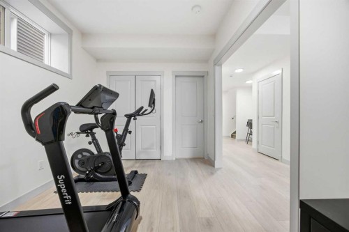 520 Kingsmere Way Se, Airdrie, AB - Indoor Photo Showing Gym Room