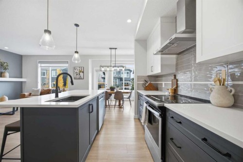 520 Kingsmere Way Se, Airdrie, AB - Indoor Photo Showing Kitchen With Upgraded Kitchen
