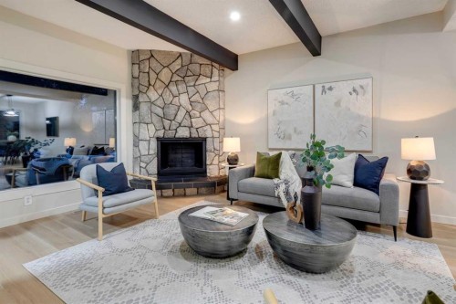 4-7166 18 Street Se, Calgary, AB - Indoor Photo Showing Living Room With Fireplace