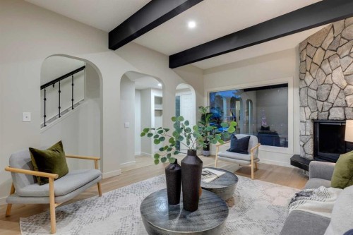 4-7166 18 Street Se, Calgary, AB - Indoor Photo Showing Living Room With Fireplace