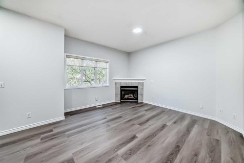 92 Simcoe Place Sw, Calgary, AB - Indoor With Fireplace