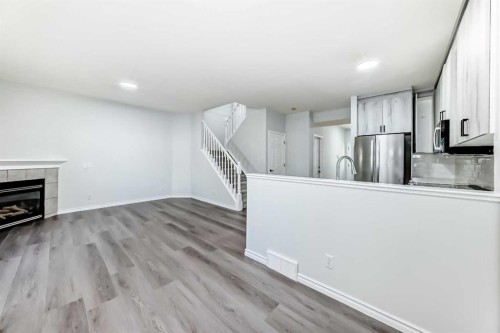 92 Simcoe Place Sw, Calgary, AB - Indoor With Fireplace