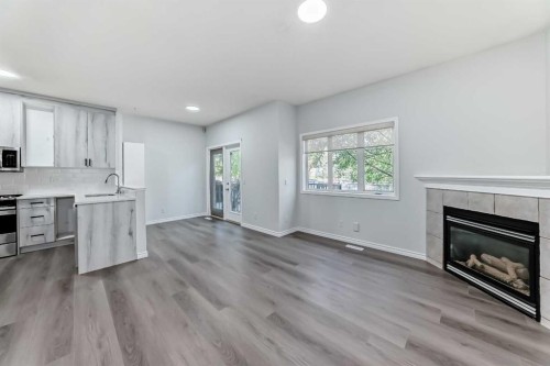 92 Simcoe Place Sw, Calgary, AB - Indoor With Fireplace