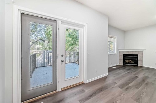 92 Simcoe Place Sw, Calgary, AB - Indoor With Fireplace