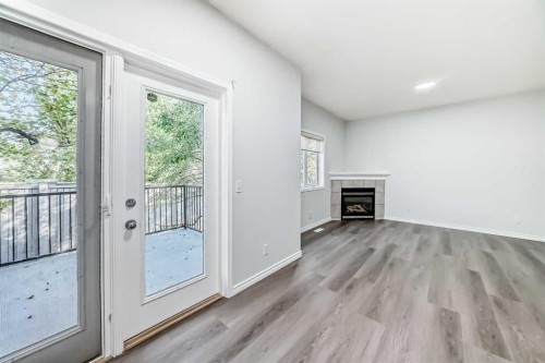 92 Simcoe Place Sw, Calgary, AB - Indoor With Fireplace