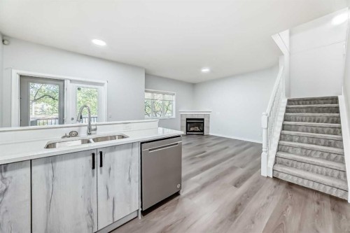 92 Simcoe Place Sw, Calgary, AB - Indoor Photo Showing Kitchen With Double Sink