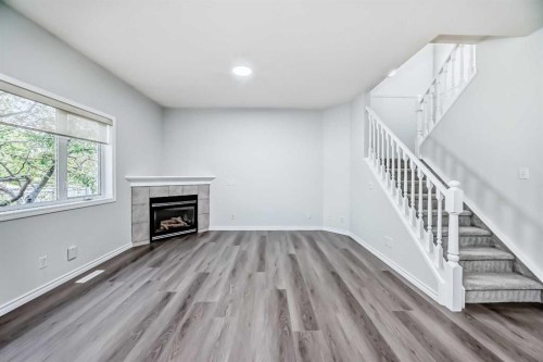 92 Simcoe Place Sw, Calgary, AB - Indoor With Fireplace