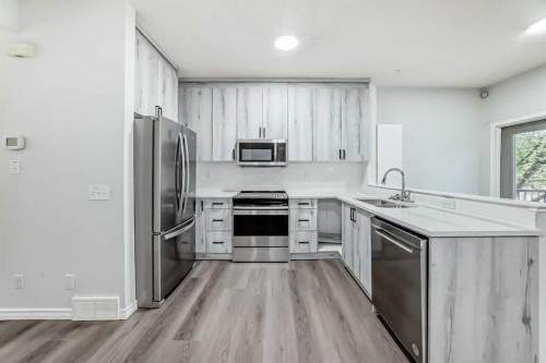 92 Simcoe Place Sw, Calgary, AB - Indoor Photo Showing Kitchen With Stainless Steel Kitchen With Double Sink With Upgraded Kitchen