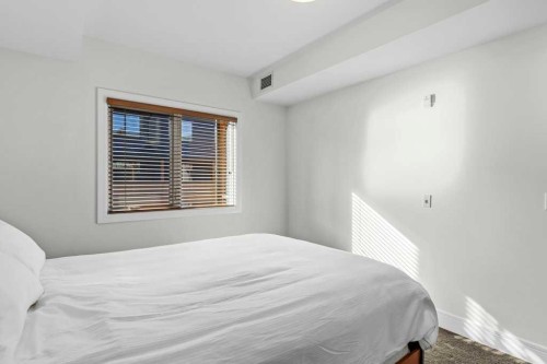 329-808 Spring Creek Drive, Canmore, AB - Indoor Photo Showing Bedroom