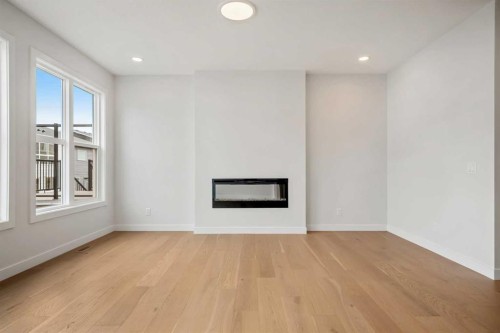 72 Amblefield Grove Nw, Calgary, AB - Indoor With Fireplace