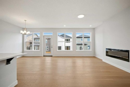 72 Amblefield Grove Nw, Calgary, AB - Indoor Photo Showing Living Room With Fireplace
