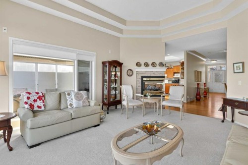 108 Hamptons Heights Nw, Calgary, AB - Indoor Photo Showing Living Room With Fireplace