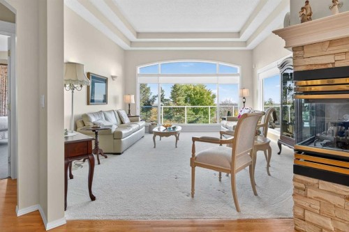 108 Hamptons Heights Nw, Calgary, AB - Indoor Photo Showing Other Room With Fireplace