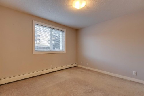 107-2440 34 Avenue Sw, Calgary, AB - Indoor Photo Showing Other Room