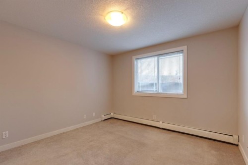 107-2440 34 Avenue Sw, Calgary, AB - Indoor Photo Showing Other Room