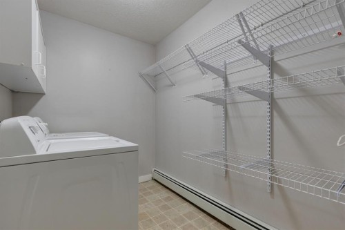107-2440 34 Avenue Sw, Calgary, AB - Indoor Photo Showing Laundry Room