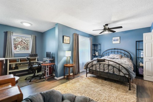 8-7 Westland Road, Okotoks, AB - Indoor Photo Showing Bedroom