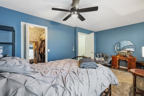 8-7 Westland Road, Okotoks, AB - Indoor Photo Showing Bedroom