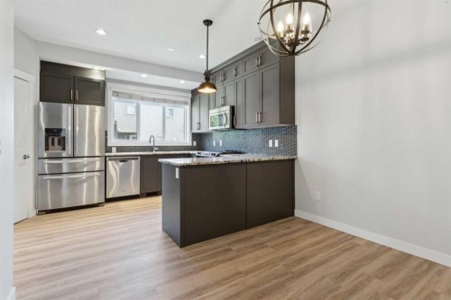 1-4513 Bowness Road Nw, Calgary, AB - Indoor Photo Showing Kitchen With Stainless Steel Kitchen