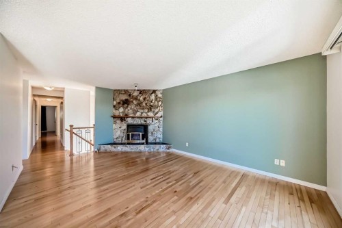 40 Glenpatrick Crescent, Cochrane, AB - Indoor Photo Showing Living Room With Fireplace