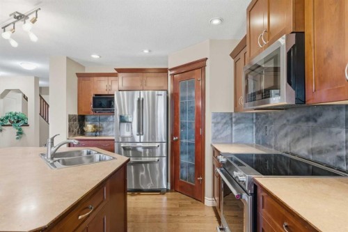 788 Luxstone Landing Sw, Airdrie, AB - Indoor Photo Showing Kitchen With Stainless Steel Kitchen With Double Sink With Upgraded Kitchen