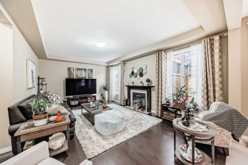 132 Waterlily Cove, Chestermere, AB - Indoor Photo Showing Living Room With Fireplace