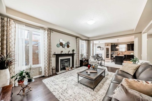 132 Waterlily Cove, Chestermere, AB - Indoor Photo Showing Living Room With Fireplace