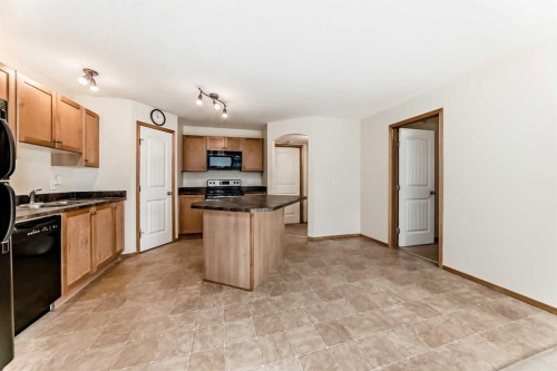106-20 Panatella Landing Nw, Calgary, AB - Indoor Photo Showing Kitchen With Double Sink