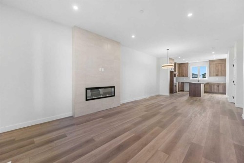 501 Hotchkiss Drive Se, Calgary, AB - Indoor Photo Showing Living Room With Fireplace
