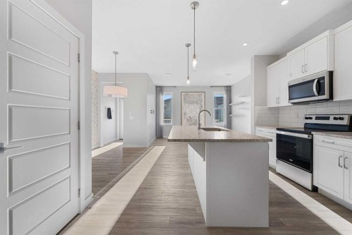 129 Hotchkiss Way Se, Calgary, AB - Indoor Photo Showing Kitchen With Upgraded Kitchen