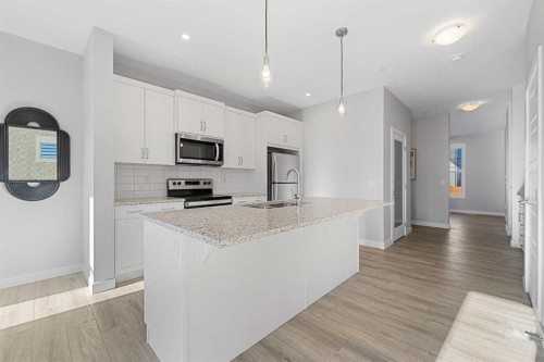 129 Hotchkiss Way Se, Calgary, AB - Indoor Photo Showing Kitchen With Upgraded Kitchen