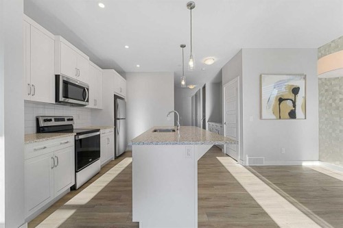 129 Hotchkiss Way Se, Calgary, AB - Indoor Photo Showing Kitchen With Upgraded Kitchen