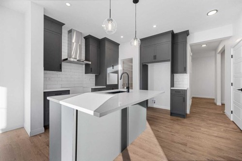 95 Dawson Wharf Mount, Chestermere, AB - Indoor Photo Showing Kitchen With Upgraded Kitchen