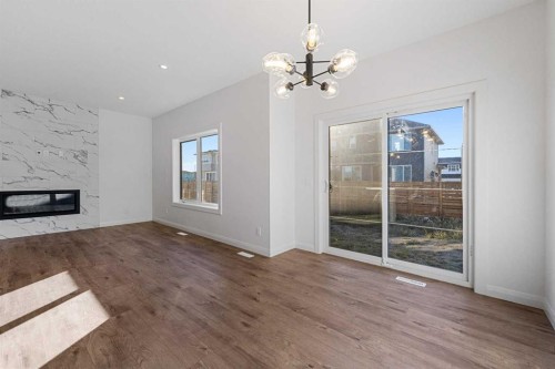 95 Dawson Wharf Mount, Chestermere, AB - Indoor Photo Showing Other Room With Fireplace