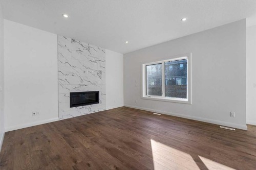 95 Dawson Wharf Mount, Chestermere, AB - Indoor Photo Showing Living Room With Fireplace