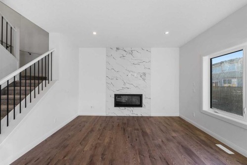95 Dawson Wharf Mount, Chestermere, AB - Indoor Photo Showing Living Room With Fireplace