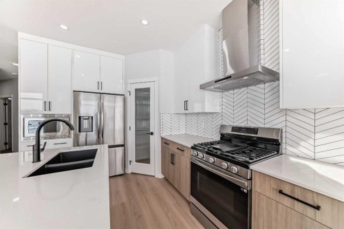 374 Corner Glen Way Ne, Calgary, AB - Indoor Photo Showing Kitchen With Double Sink With Upgraded Kitchen