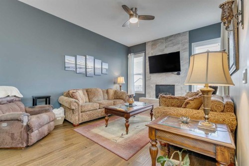 109 Amery Crescent, Crossfield, AB - Indoor Photo Showing Living Room With Fireplace