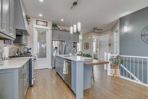 109 Amery Crescent, Crossfield, AB - Indoor Photo Showing Kitchen With Upgraded Kitchen