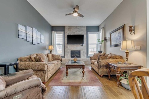 109 Amery Crescent, Crossfield, AB - Indoor Photo Showing Living Room With Fireplace