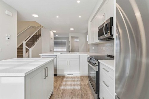 201 Magnolia Terrace Se, Calgary, AB - Indoor Photo Showing Kitchen With Stainless Steel Kitchen With Upgraded Kitchen