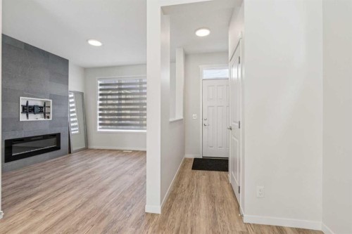 201 Magnolia Terrace Se, Calgary, AB - Indoor Photo Showing Other Room With Fireplace