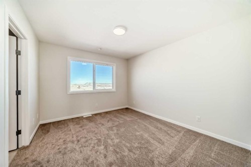 1030 Sawgrass Link Nw, Airdrie, AB - Indoor Photo Showing Other Room