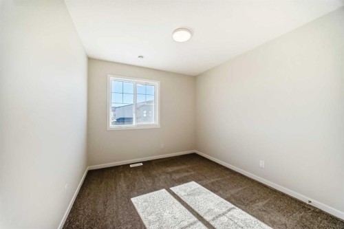 1030 Sawgrass Link Nw, Airdrie, AB - Indoor Photo Showing Other Room
