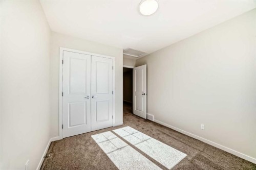 1030 Sawgrass Link Nw, Airdrie, AB - Indoor Photo Showing Other Room
