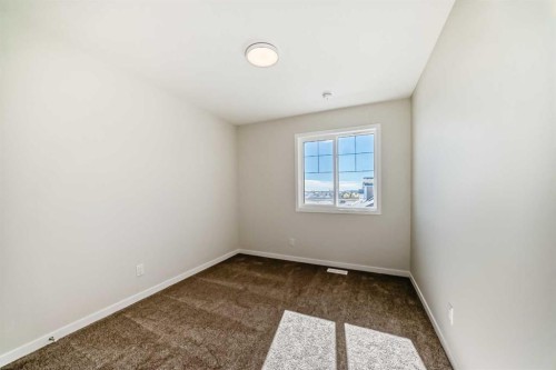 1030 Sawgrass Link Nw, Airdrie, AB - Indoor Photo Showing Other Room