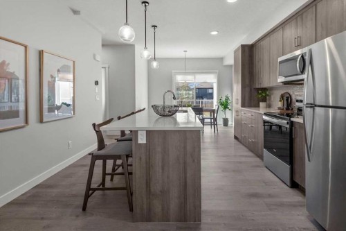 507 Shawnee Square Sw, Calgary, AB - Indoor Photo Showing Kitchen With Stainless Steel Kitchen With Upgraded Kitchen