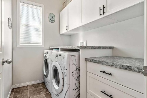 394 Cimarron Boulevard, Okotoks, AB - Indoor Photo Showing Laundry Room