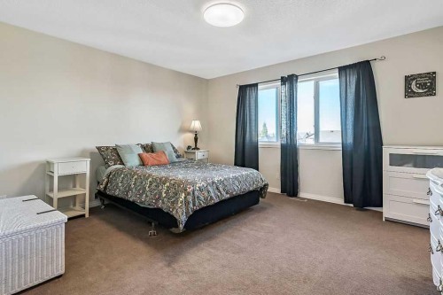 394 Cimarron Boulevard, Okotoks, AB - Indoor Photo Showing Bedroom