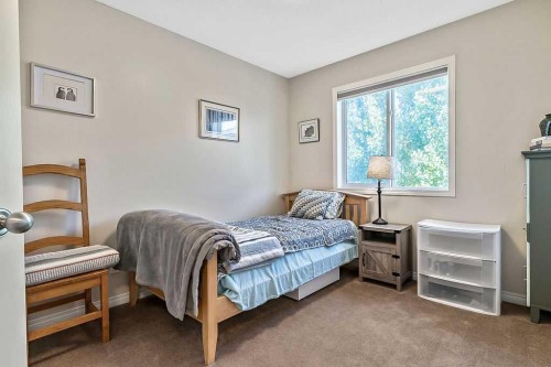 394 Cimarron Boulevard, Okotoks, AB - Indoor Photo Showing Bedroom